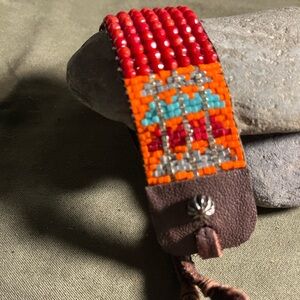 Gemstones and seed beads and leather cuff bracelet.